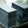 Stacks of cut Plike paper. Paper cutting isn't glamorous, but it's a very important step.